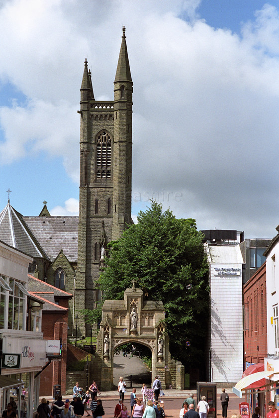 DCP0344 
 St Mary s RC Church from Chapel Street in Chorley town centre 
 Keywords: Lancashire Lancs England UK Britain North West Northwest Chorley Town Center Chapel Street St Saint Mary Church Catholic Architecture Building Religion Religious Tower Steeple Busy Shop Shopping Commerce Business Vertical DCP0344