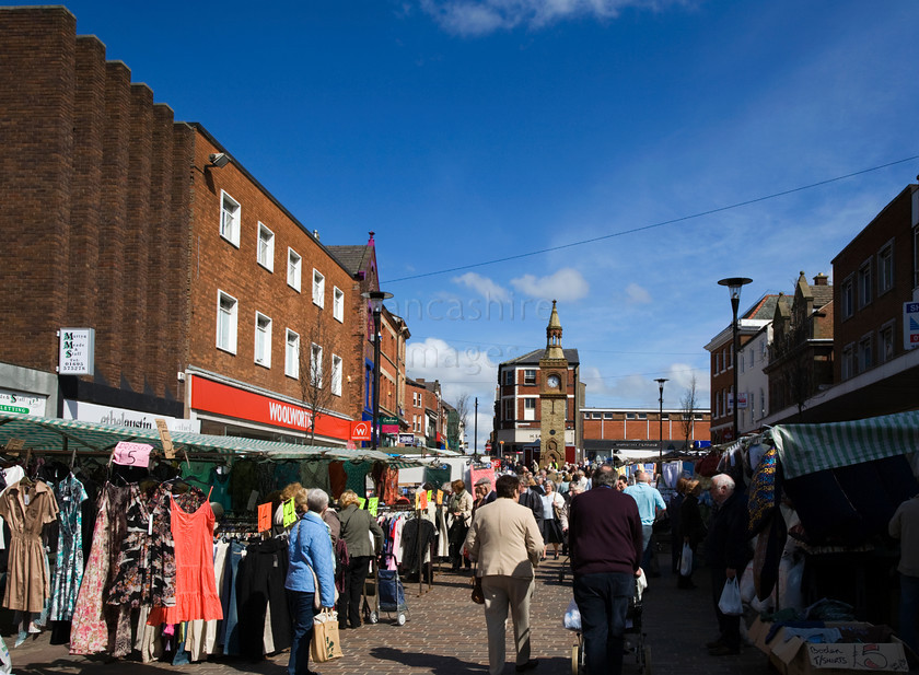 DCP1555 
 Ormskirk town centre on market day 
 Keywords: Ormskirk, town, centre, market, day, stall, clock, tower, Lancashire, Lancs, Northwest, North, West, England, UK, Britian, Europe, busy, bustle, bustling, commerce, business, tade, trading, wide, angle, DCP1555