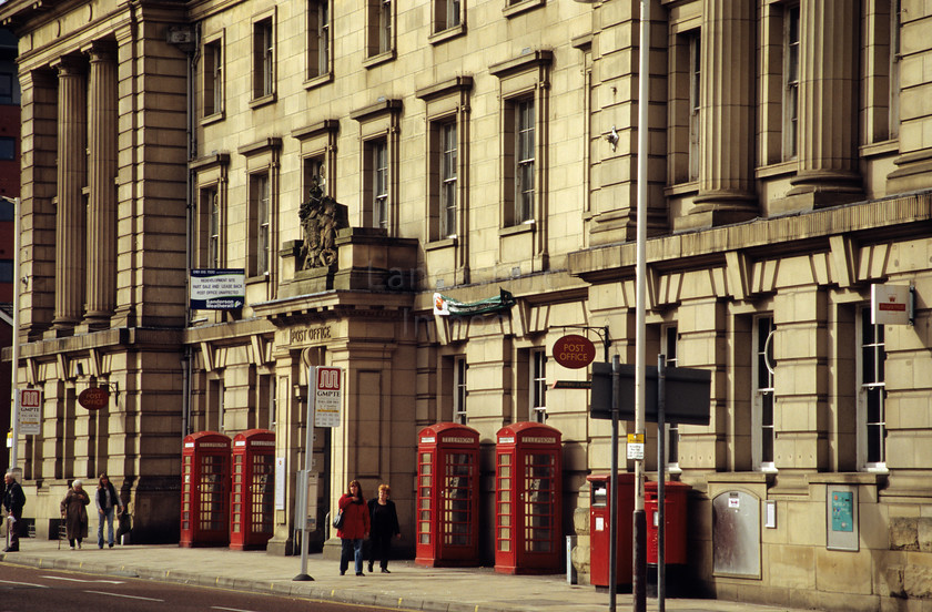 DCP0487 
 Post office and traditional red telephone booths in Bolton 
 Keywords: Lancashire Lancs North West Northwest Engalnd UK Britain Europe Bolton town post office red telephone booth kiosk line post box postal imposing impose impress impressive dominate dominant communicate communication entrance telecommunication four public architecture tradition traditional heritage horizontal DCP0487