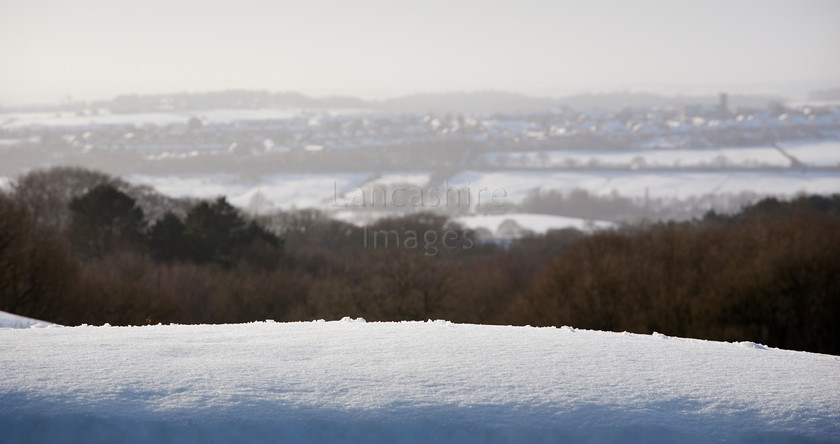 DCP2335 
 Snow bank with village of Blackrod in distance 
 Keywords: Blackrod, texture, Rivington, weather, winter, snow, Lancs, Lancashire, England, Britain, UK, Europe, DCP2335