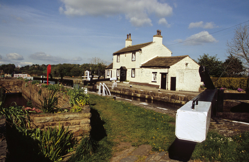 DCP0255 
 Lock keepers cottage at Barrowford Locks on Leeds Liverpool Canal 
 Keywords: Lancashire Lancs England UK Britain Lock Keeper Cottage Barrowford Barrow Ford Leeds Liverpool Canal Transport Architecture Building Industry Heritage Water House Gate Lifestyle Travel Holiday Tow Path Horizontal DCP0255