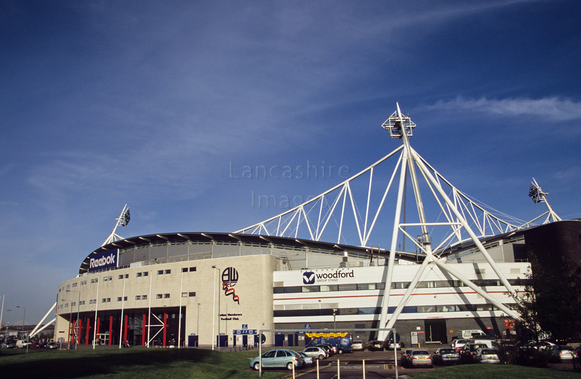 DCP1028 
 The Reebok Stadium in Bolton home to Bolton Wanderers Football Club 
 Keywords: Bolton, Wanderers, Football, Club, Reebok, Stadium, Horwich, Middlebrook, Retail, Park, Lancashire, Lancs, North, West, Northwest, England, UK, Britain, Europe, modern, architecture, structure, arena, sport, sporting, game, BWFC, floodlight, curve, curving, concave, strut, leisure, lifestyle, landmark, carpark, car, park, entrance, support, shape, abstract, blue, sky, horizontal, DCP1027